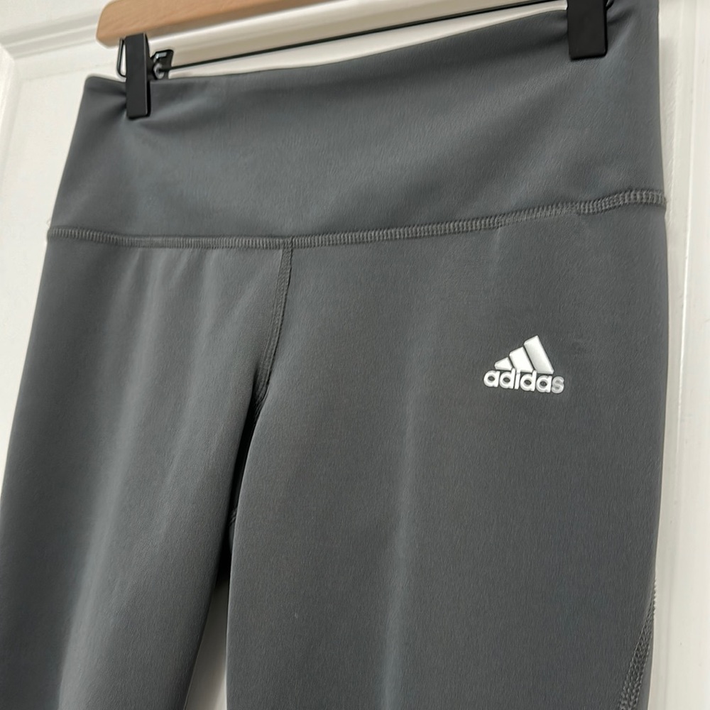 Gray adidas leggings. Adidas logo on left pant.